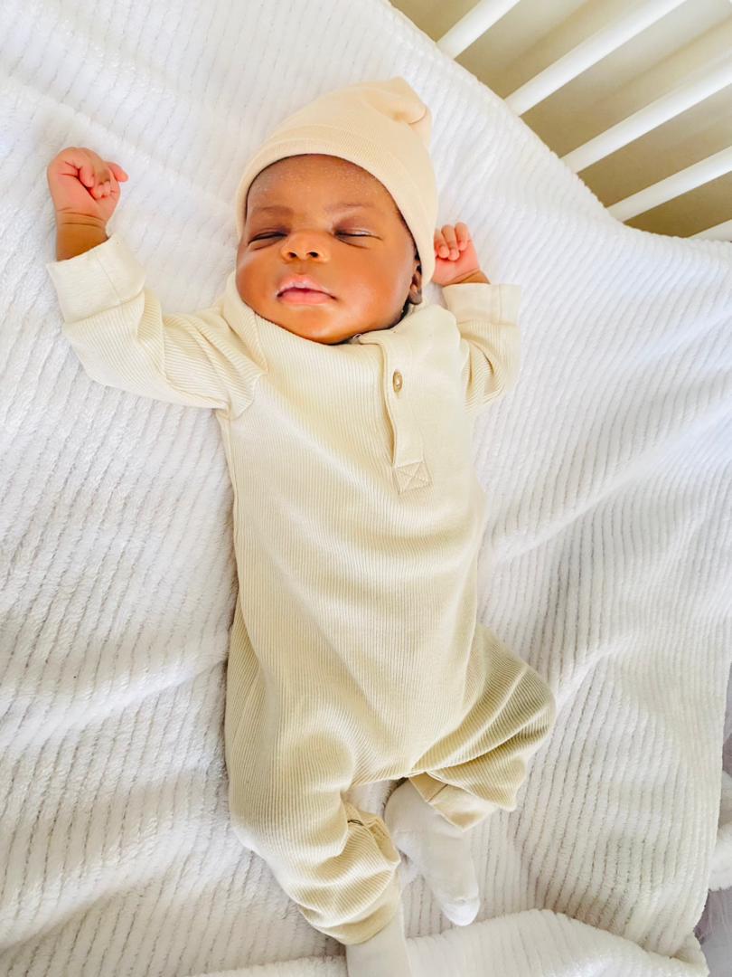 Precious IVF newborn in cream outfit at Sali fertility centre (privacy protected)
