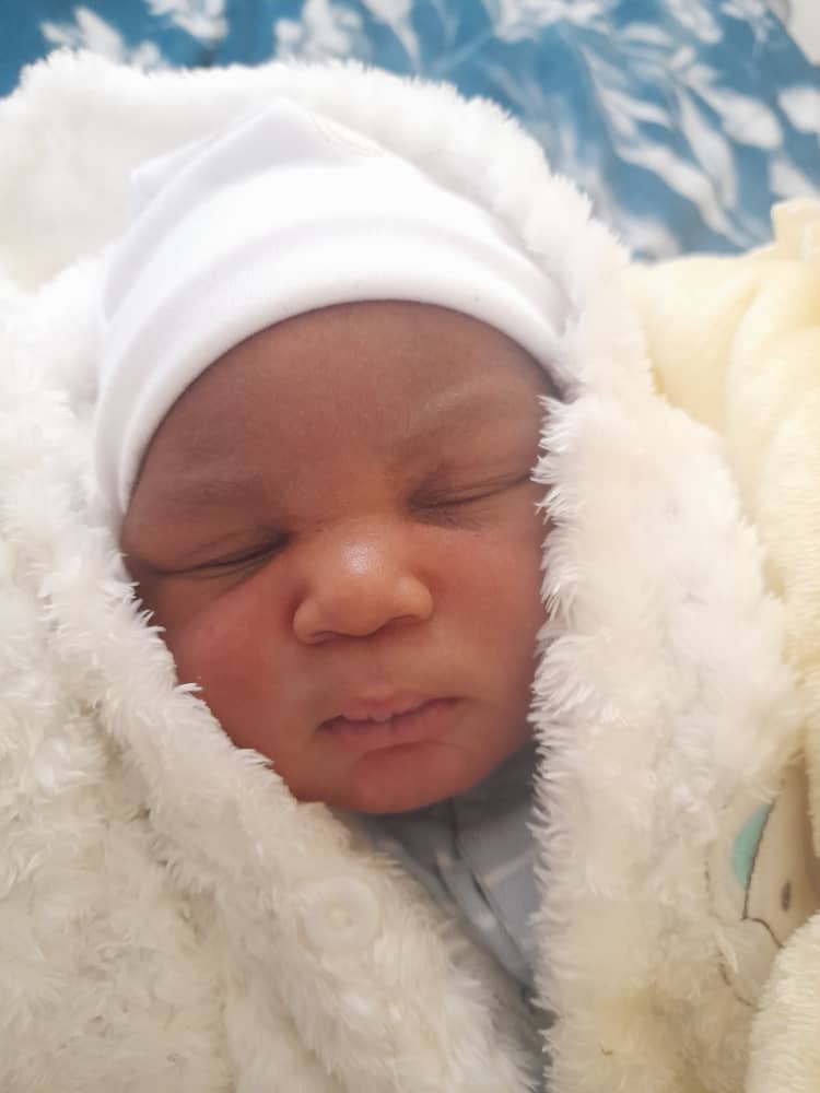 Beautiful IVF newborn in white cap at Sali Women's Hospital (privacy protected)